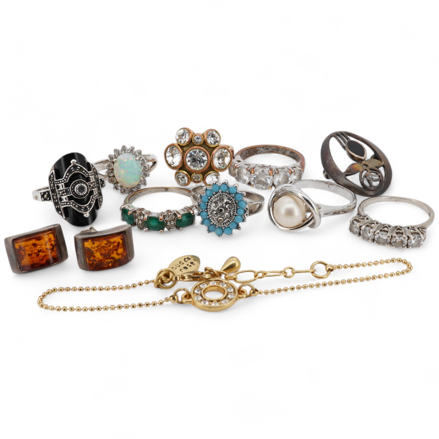 Assorted jewellery including a 925, black onyx and marcasite set Art Deco style ring, three other 925 rings, a pair of 925 amber ear studs and a 925 brooch, together with four costume rings and a costume bracelet.